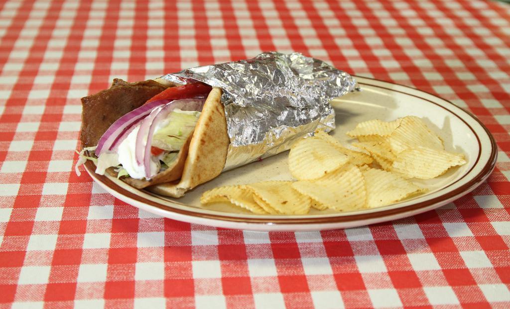Gyro Sandwich · Traditional creamy cucumber sauce, choice of meat, lettuce, tomato and onion on fluffy pita bread.