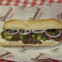Philly Steak Sub · Topped with onions, green peppers, Lettuce, Tomato cheese and mayo on a golden brown bun.