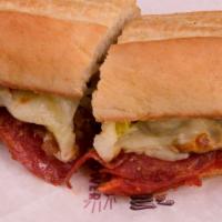 Italian Submarine Sandwich · Salami, cheese, ham, crisp lettuce, onion, own sub sauce, tomato and mayo on a golden brown ...