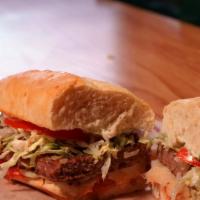 Big Red Sub · Steak with crisp lettuce, onions, cheese, mushrooms and special red dressing on a golden bro...