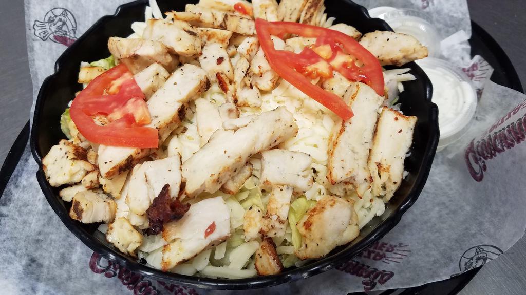 Grilled Chicken Salad · Fresh garden greens with grilled chicken topped with cheese tomato slices and bacon bits. Served with 2 packs of dressing and crackers.
