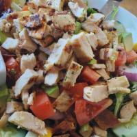 Manhattan Chopped Cobb Salad · Grilled diced chicken breast served on top of chopped baby mixed greens with avocado, hard-b...