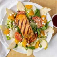 Grilled Salmon Salad · Grilled salmon fillet placed on a bed of baby mixed greens topped with sliced pears, mandari...