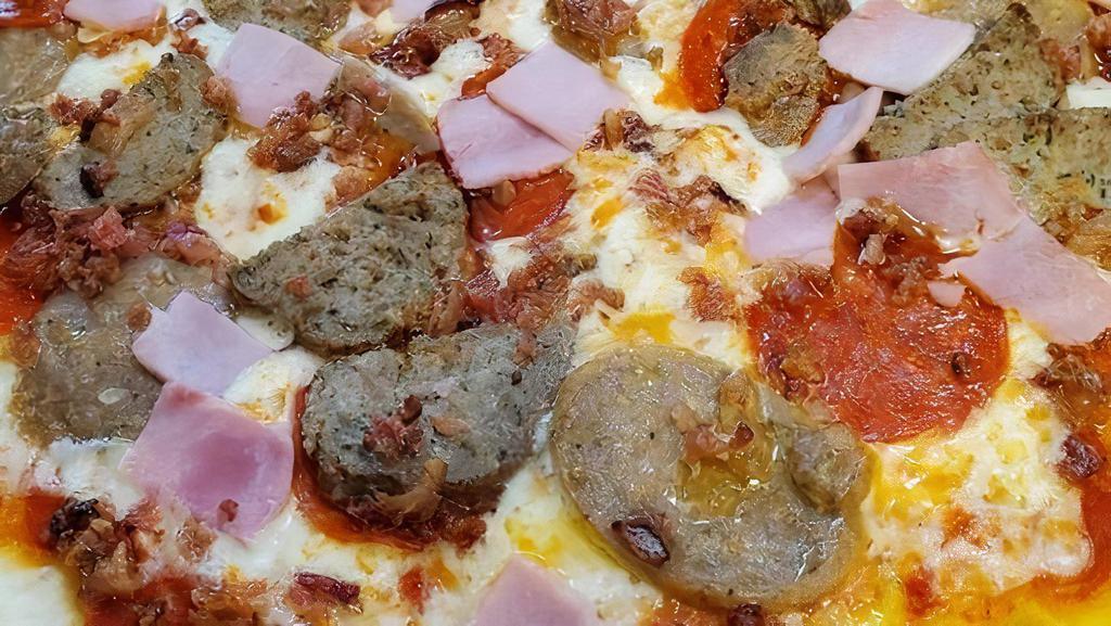 Large Mighty Meat Pizza · Homemade pizza sauce, pepperoni, sausage, ham, meatball, and bacon