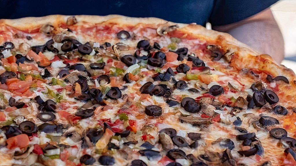 Large Veggie Pizza · Homemade pizza sauce, mushrooms, peppers, onions, black olives and tomatoes.