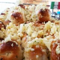 Garlic Rolls · Freshly made pizza dough rolled and baked and marinated in extra virgin olive oil, fresh par...