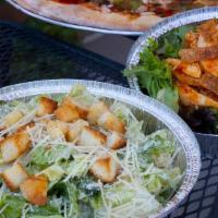 Caesar Salad · Romaine lettuce, croutons, and shredded parm cheese, served with a side of Caesar dressing
