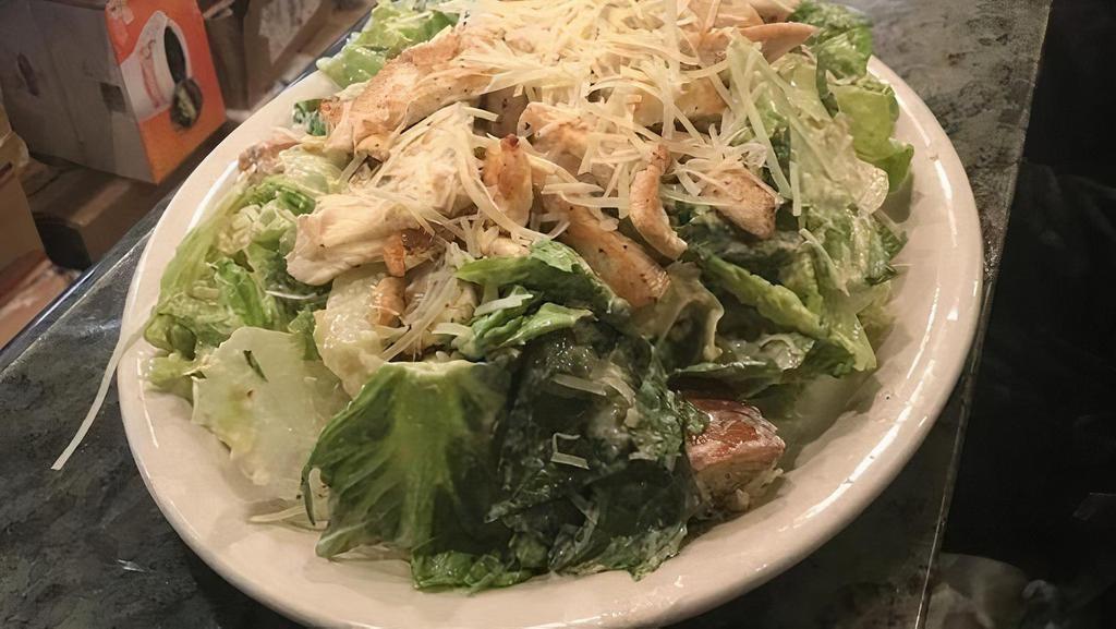 Chicken Caesar Salad · Romaine lettuce, Grilled Chicken, croutons, and shredded parm cheese, served with a side of Caesar dressing.