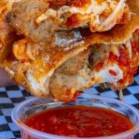 Meatball Parm Boli · Grande Cheese with mamas meatballs  tossed in homemade marinara, baked to perfection, served...