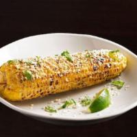 Elote - Mexican Corn · Mayonnaise, fresco cheese, chopped cilantro, classic seasoning, lime wedge.