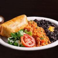 Chimichanga ~ · A fried burrito with your choice of meat and cheese inside. Served crispy with sour cream an...