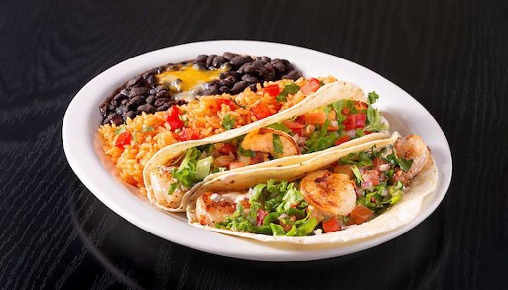 Shrimp Taco Platter · 2 Grilled shrimp tacos served El Fresco style (chipotle sour cream, lettuce & pico) or Street style (cilantro, white onions, a lime slice) in a shell of your choice. Spanish rice & beans on the side.