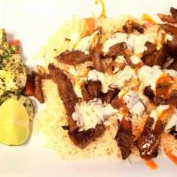Lamb Over Rice (Halal) · Lamb marinated in special herbs over the grill with fried onion, tzatziki sauce and special ...