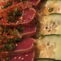 Seared Tuna Tataki · A wonderful presentation of seared maguro tuna and thinly sliced cucumber drizzled with a ci...