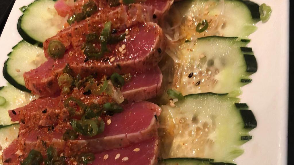 Seared Tuna Tataki · A wonderful presentation of seared maguro tuna and thinly sliced cucumber drizzled with a citrus chili ponzu sauce grilled chicken.