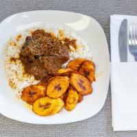 White Rice W/ Goat Or Fish · Served with plantains and red stew, buka (designer) stew or cassava leaf, with goat or fish.