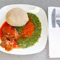 Eba W/ Goat Or Fish · Served with efo egusi, efo riro, ogbono, ewedu, cassava leaf or okra and red stew with goat ...