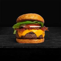 Boomin' Bacon Burger · Cheddar Cheese, Smoked Bacon, Lettuce, Tomato and Ruby's Burger Sauce.