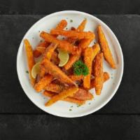 Sweet Spuds · Shredded Sweet potatoes formed into fries, battered, and fried until golden brown.