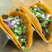 Taco Dinners · Includes 3 street style tacos, rice and beans.