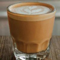 Cortado · Double shot espresso with equal amount of steamed milk.