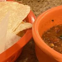 Chips And Salsa · Fresh house made salsa served with chips. If you don't like cilantro  you won't like our sal...