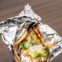 Chicken Gyro Sandwich · Gyros originate from Greece and are a sandwich made with pita bread and gyro meat, topped wi...