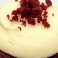 Red Velvet Cupcake · Red velvet cake with cream cheese frosting topped with red velvet crumbs.