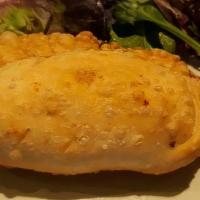 Cheese Empanada · Lightly Fried Pastry Filled with 3 cheeses. Served with Salsa Picante