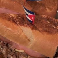 Sandwich Cubano · Our best seller . roast pork . ham . swiss cheese . pickles . mustard