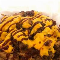Kansas City Fries · Large portion of fries served with fresh BBQ pulled pork made in house then smothered in cre...