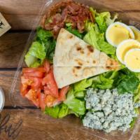 Cobb · Cobb Salad made fresh with Bacon, Egg, Tomato, and Blue Cheese.  Comes with Ranch Dressing a...