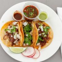 4 Tacos · Choice of meat, onion, cilantro, radish, lime, multiple sauces.