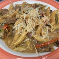 Backyard Steak Tips · Beef tips, peppers, onions and mushrooms sautéed with marsala cream sauce, tossed with penne...