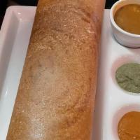 Masala Dosa · Thin crispy crepe with mashed potatoes and peas fillings. Served with chutney and sambar. Ve...