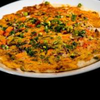 Uthappam Mixed · Rice and lentil batter thick pancake with onion, tomato and chili toppings. Vegan and Gluten...