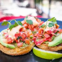 Lobster Avocado Toast · Parmesan crusted brioche toast spread with house-made guacamole then topped with lobster mea...