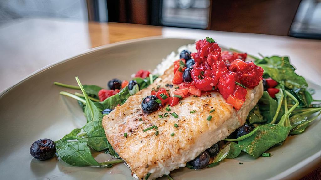 Berry Mahi Mahi · Mahi Mahi rubbed with our house seasoning, and then seared. Served over a bed of coconut jasmine rice and locally grown arugula lightly tossed in a citrus vinaigrette finished with a fresh berry salsa