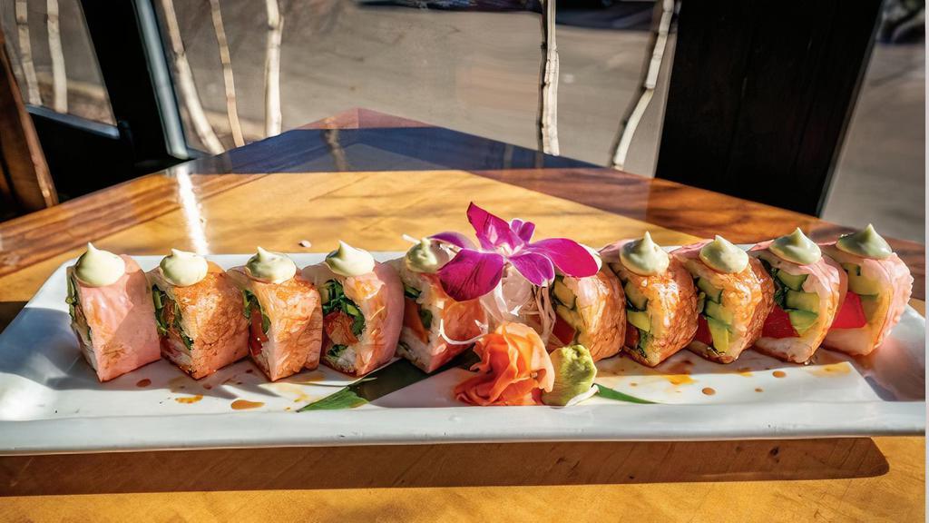 Pink Panther · tuna, yellowtail, salmon, cilantro, avocado, cucumber wrapped in soy paper, then topped with spicy yuzu, rosemary wasabi aioli topped