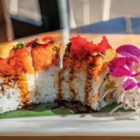 Surfer Roll · shrimp tempura, cream cheese, avocado, wrapped in nori and sushi rice, then topped with spic...
