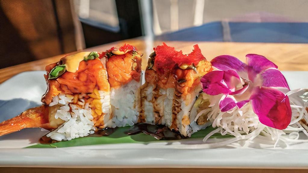Surfer Roll · shrimp tempura, cream cheese, avocado, wrapped in nori and sushi rice, then topped with spicy tuna, tobiko, eel sauce, and spicy mayo