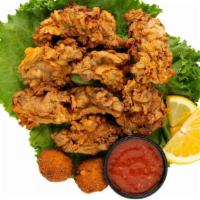 Fried Oyster Basket · Our fresh oysters, seasoned and battered, fried golden and served with hush puppies and your...