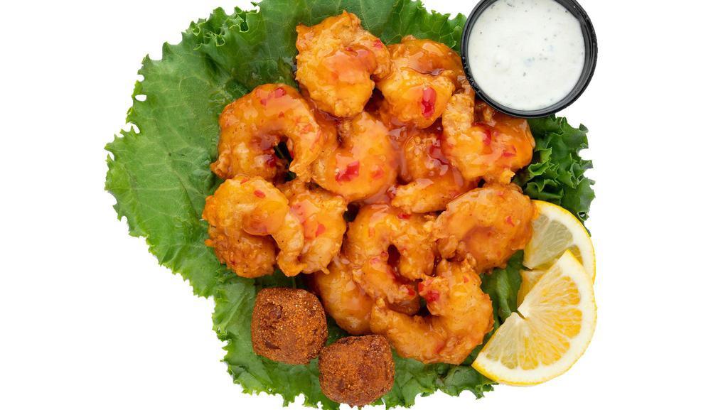 Buffalo Shrimp Basket · Grilled or hand-breaded fried shrimp tossed in any of our Signature Sauces served with hush puppies and your choice of ranch or blue cheese dressing