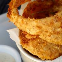 Buttermilk Onion Rings · Double-dipped and extra crispy. Ranch dipping sauce.