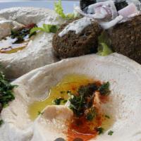 Hummus Or Baba Ghanouj Plate · Topped with your choice of chicken, gyro, or falafel.