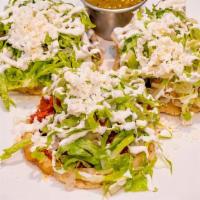 Sopecitos Mixtos · With chicken, steak, chorizo. Served with black beans, lettuce, sour cream, fresh cheese and...