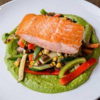 Salmon A La Plancha · Served with pea puree and sauteed season vegetables.