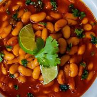 Fasolia · Our house special seasoned white beans cooked with tomatoes, onions and spices.
