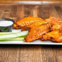 Chicken Wings · Fresh plump chicken wings fried and tossed in your seasoning of choice.