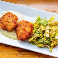 Crab Cake Medallions · Delicious crab meat served with creamy mustard seed sauce and mixed greens.